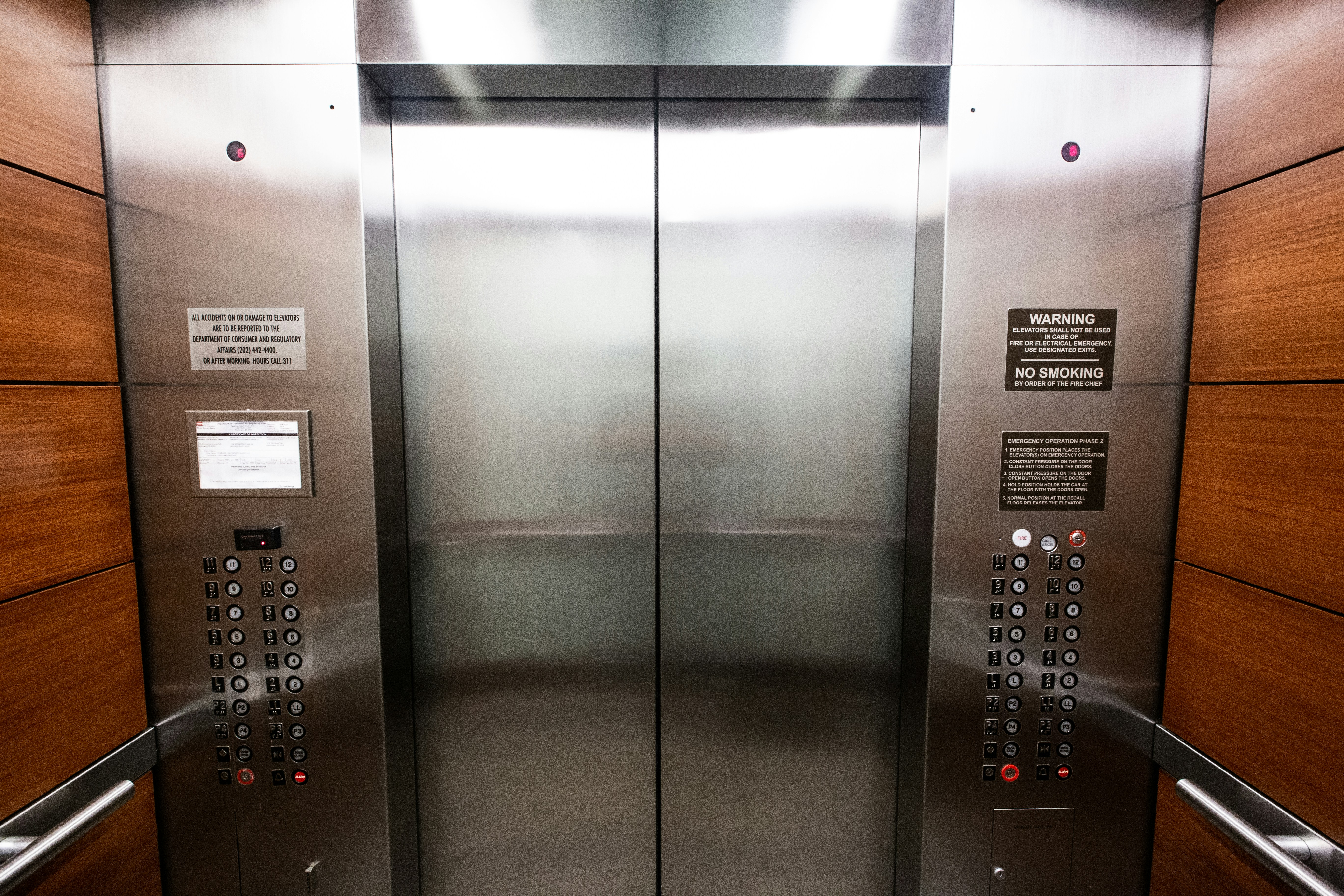 Modern stainless steel elevator interior representing factory-direct elevator manufacturing quality