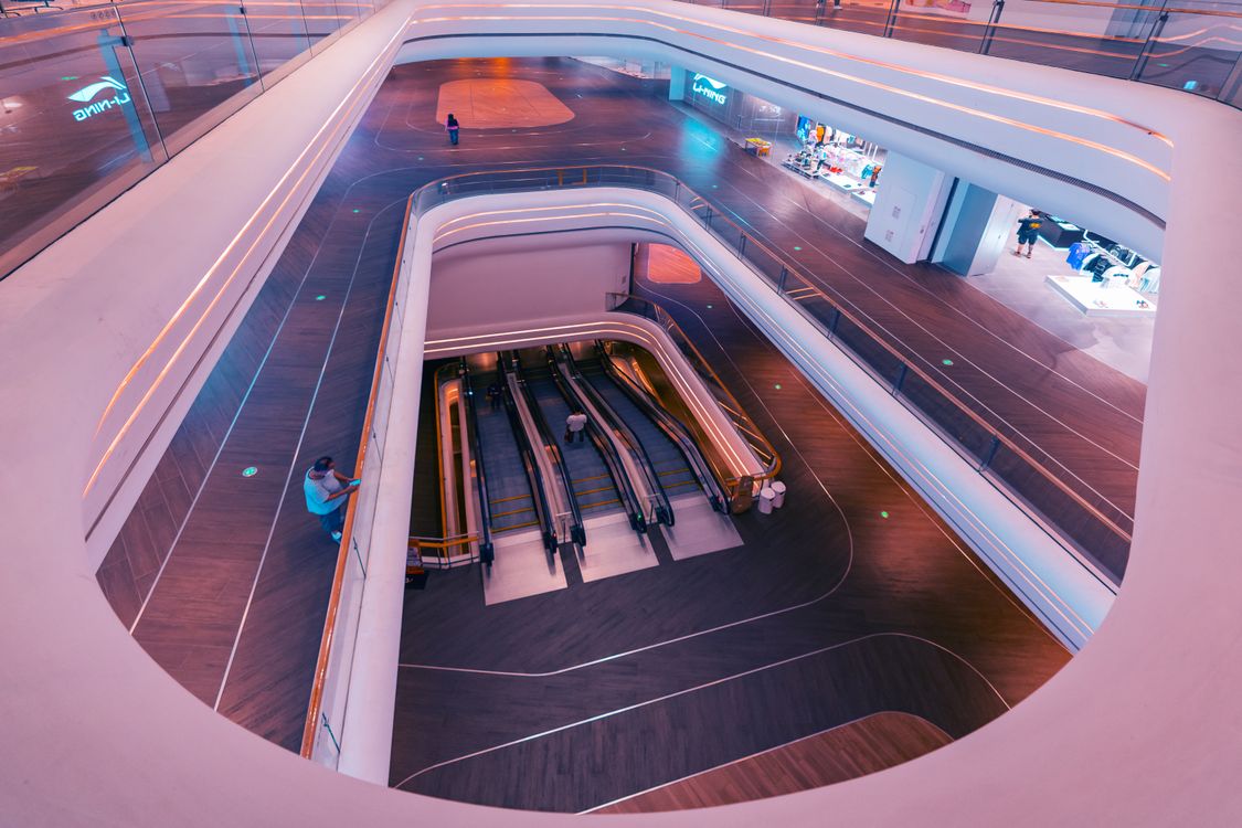 Modern escalators in a multi-level commercial shopping mall in Dubai