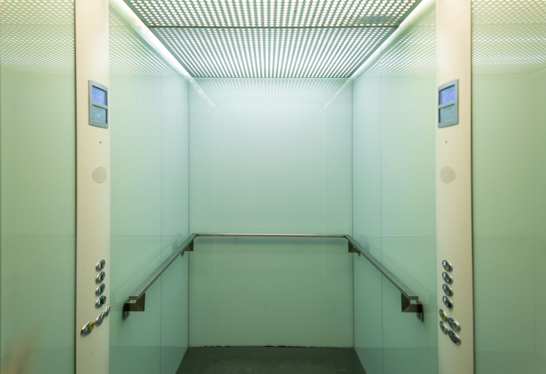 Modern elevator interior with warm lighting — typical of premium passenger lifts installed in Dubai residential and commercial buildings